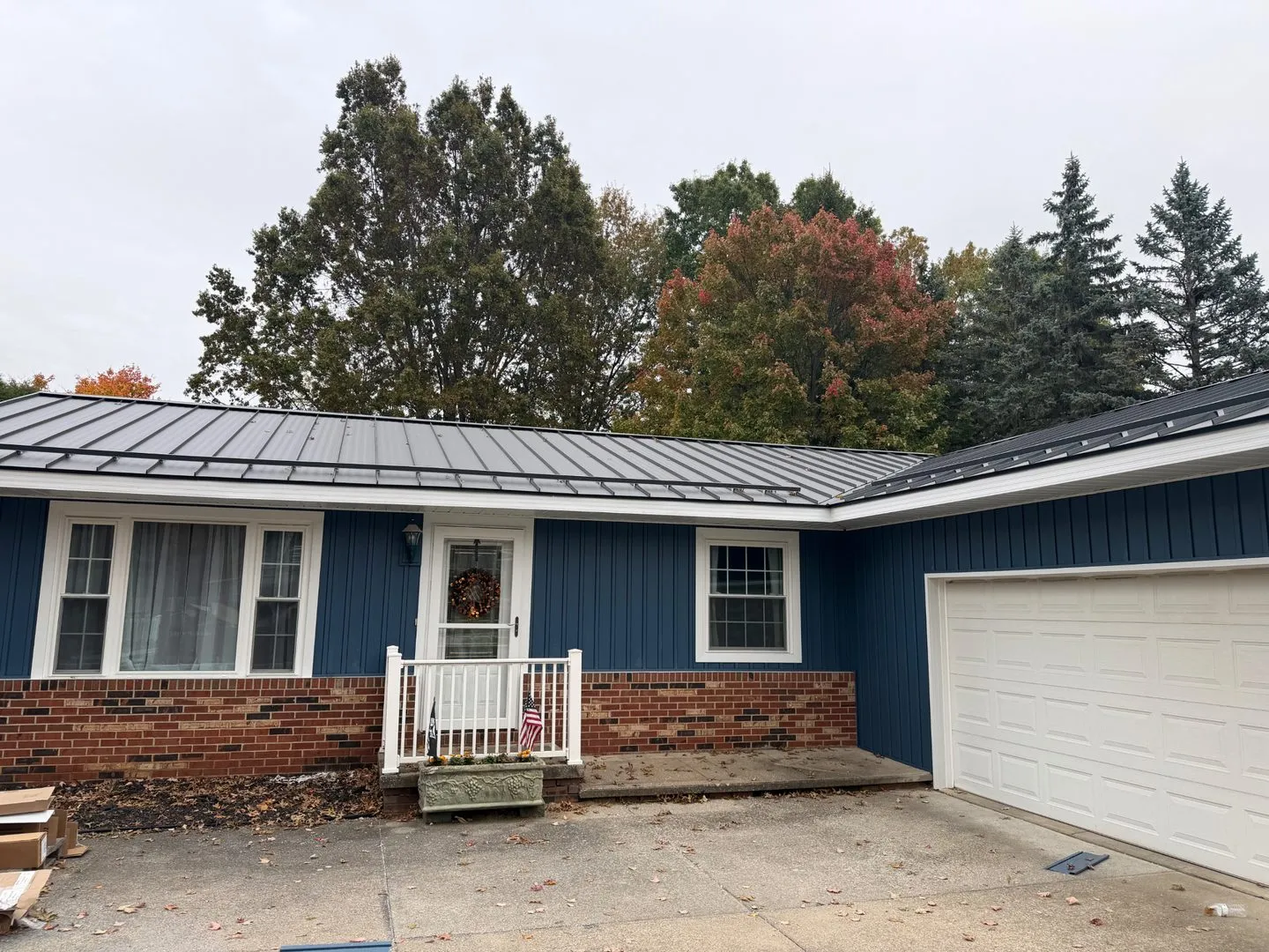 Completed blue vinyl siding project