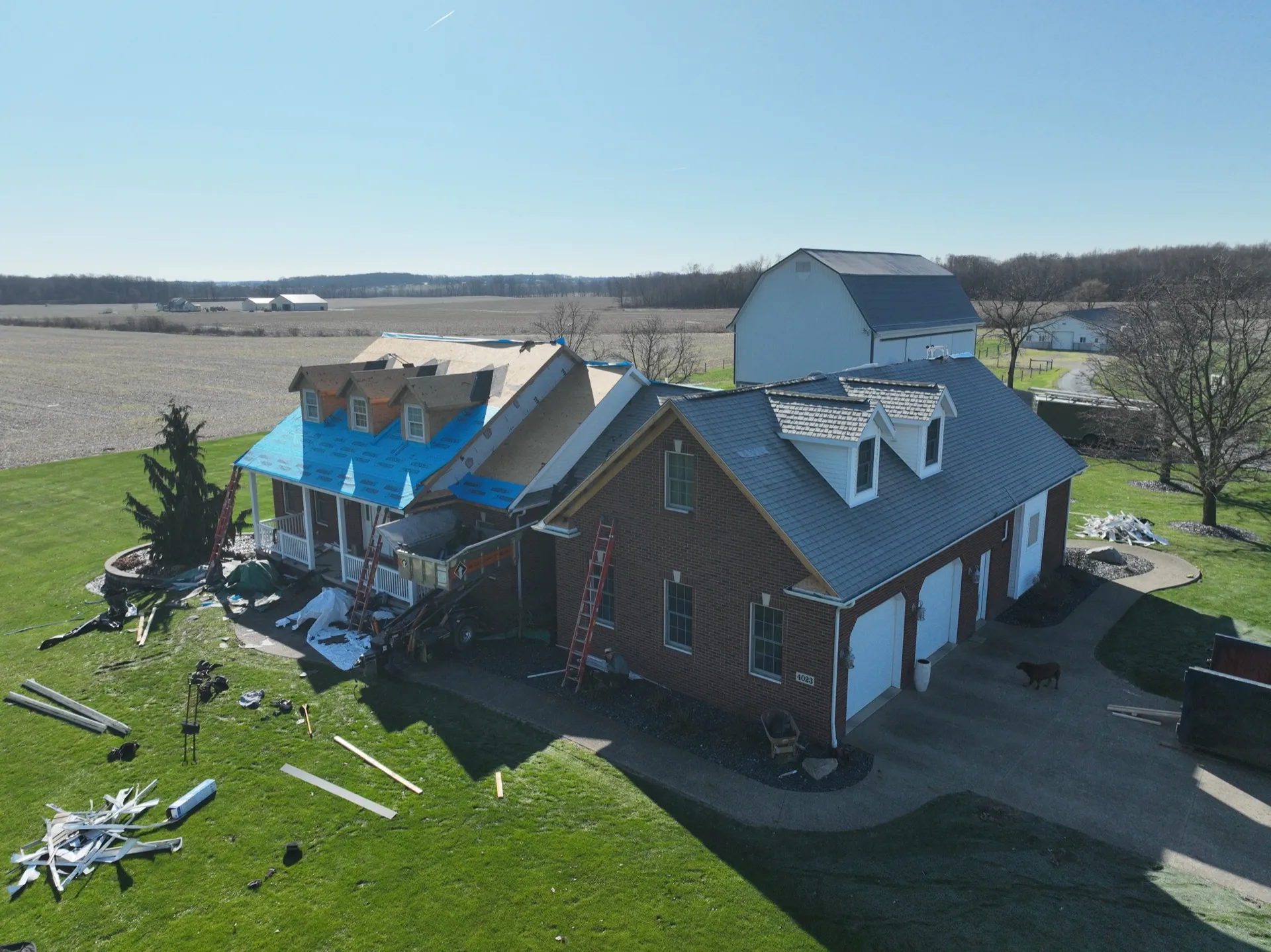 Aerial view of completed roof replacement on brick ranch home in Kent Ohio